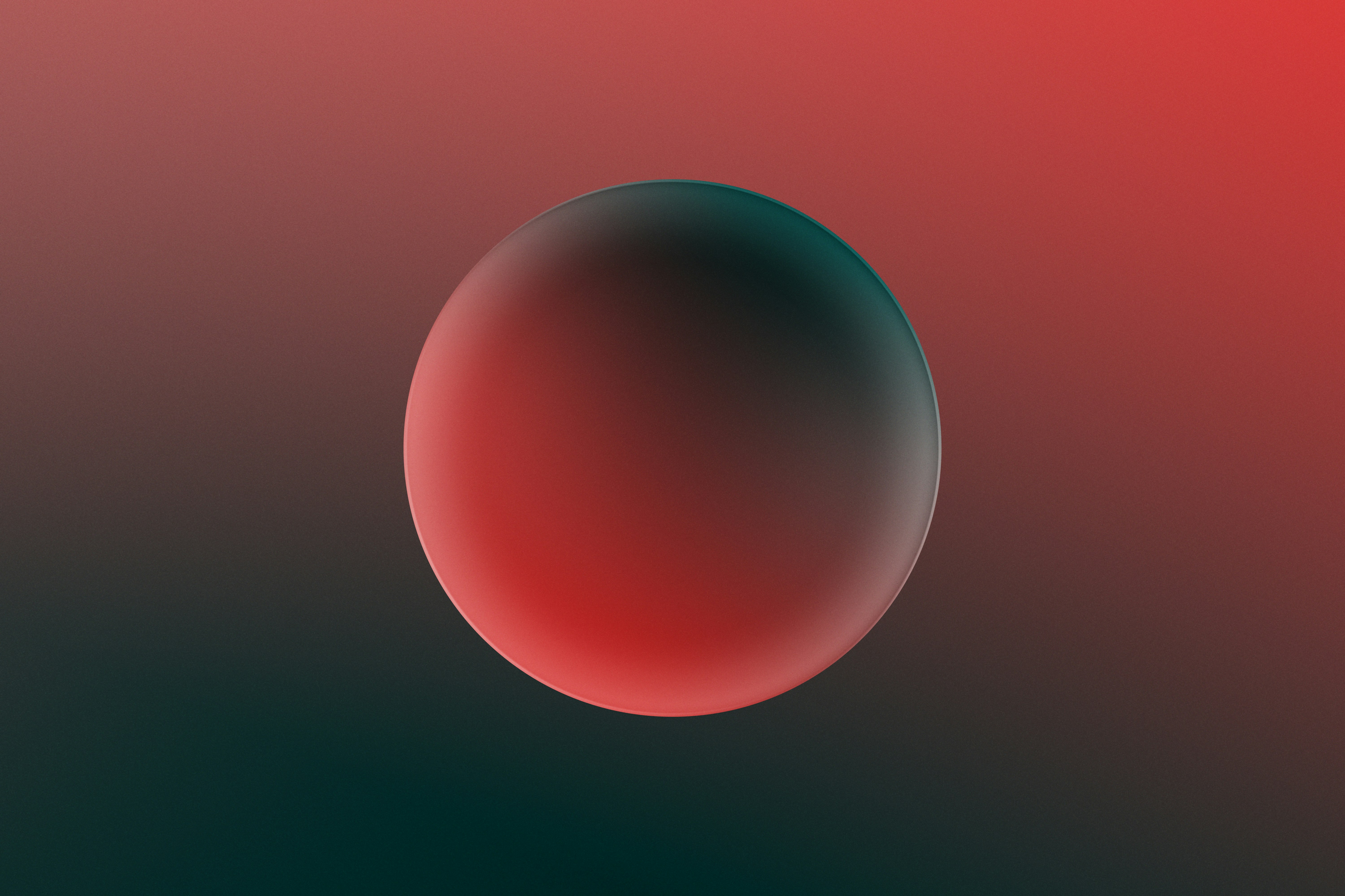 A softly lit red sphere suspended against a red and dark green gradient field